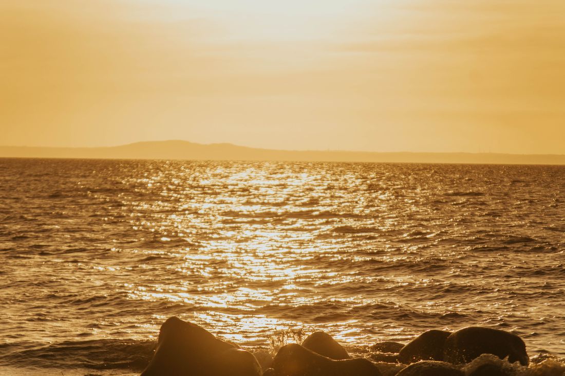 Golden light reflected across the ocean